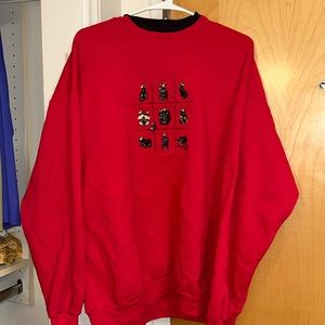 Red sweatshirt with black collar and cute black bear embroidery.